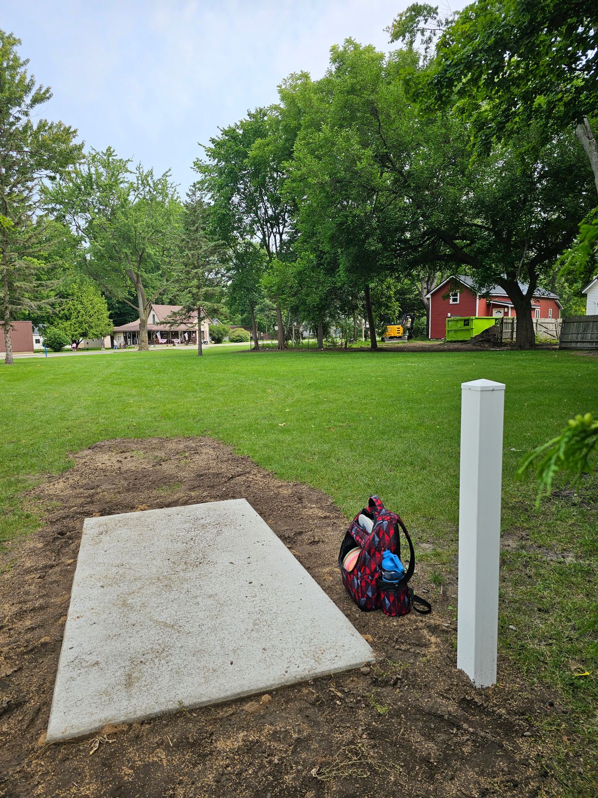 Hole 8 basket to tee. Mando left of someone's backyard, hard right.