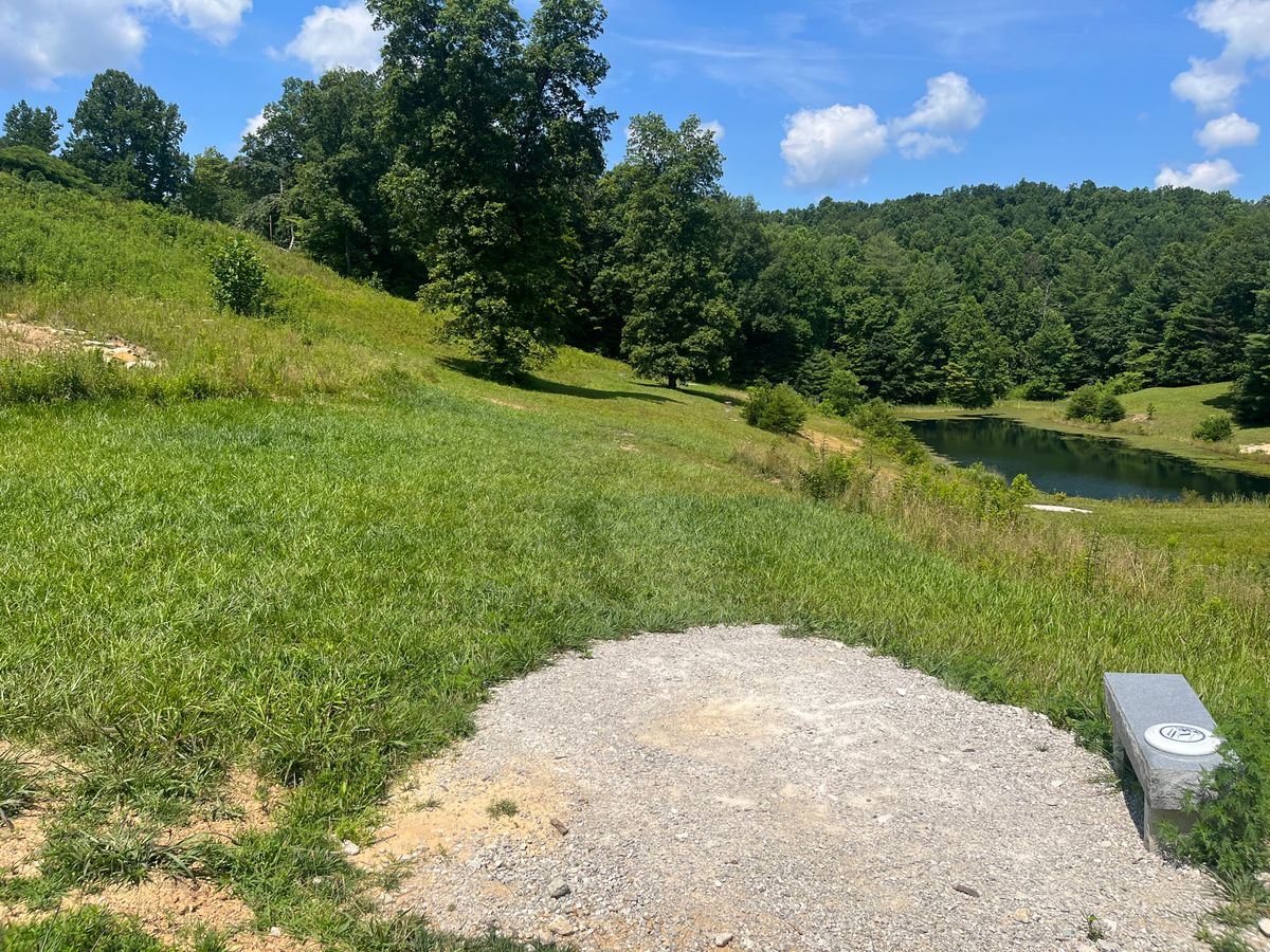 Tee for hole 2 is on top of the dam to the right.  