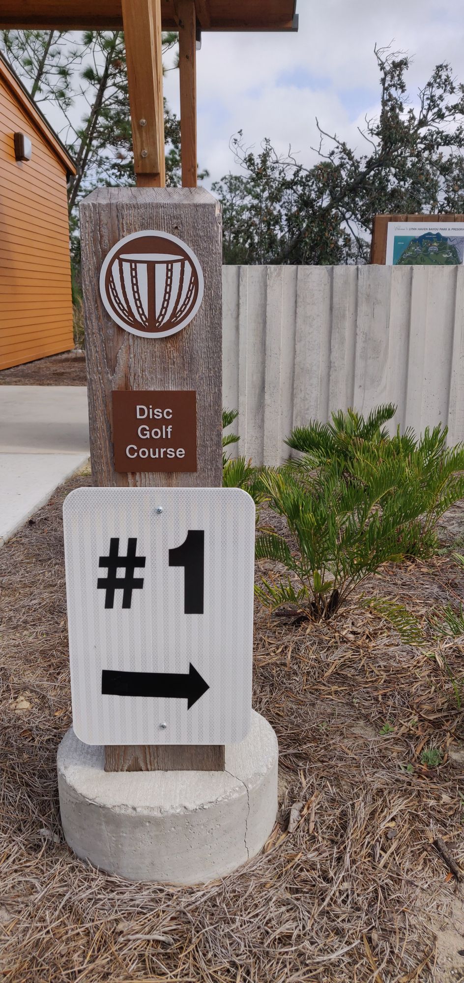 Sign at parking by the bathrooms and map kiosk