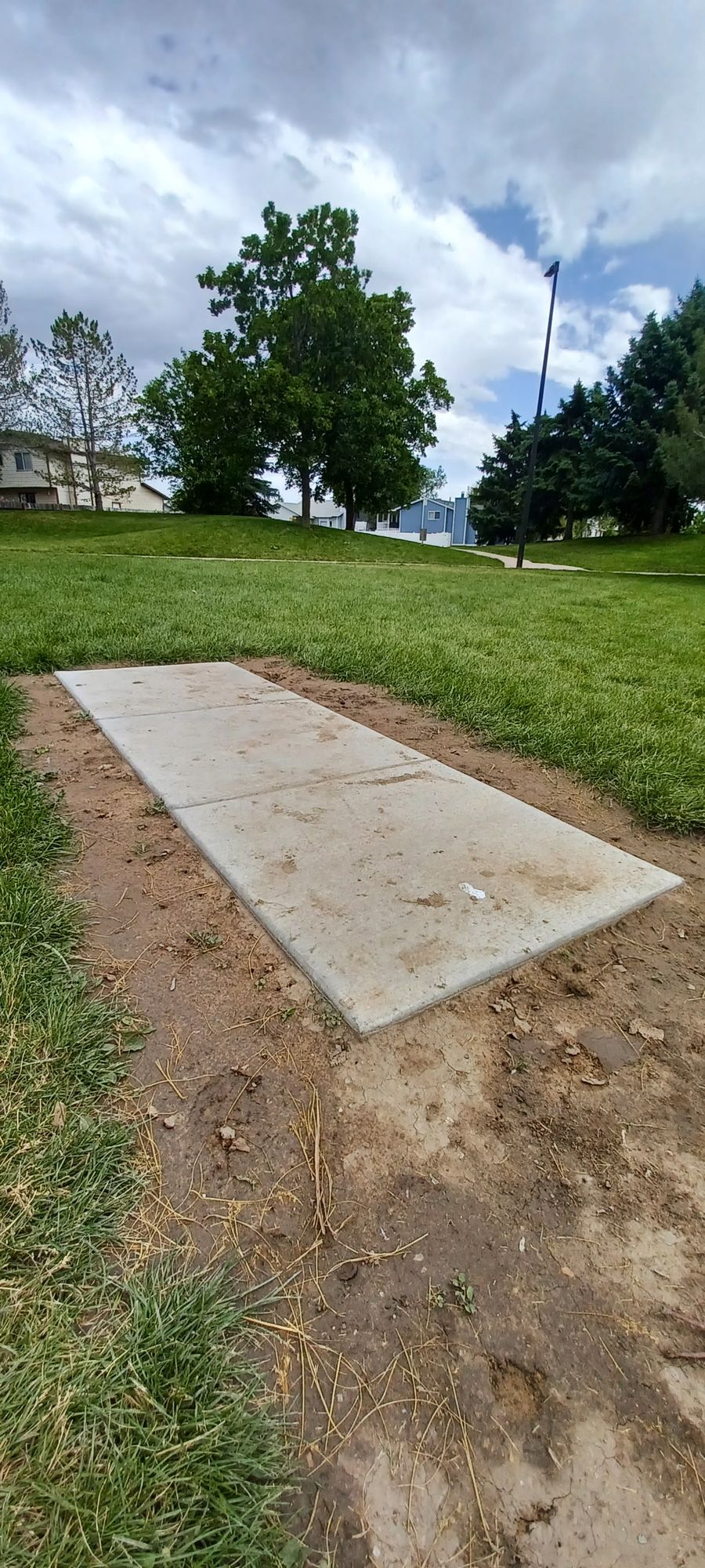 6th Tee Platform. Basket is on the other side of the hill. 

Watch out for others. Basket is on other side of walking path.

*This is the 15th hole as well, if you are using the 18 hole scorecard.