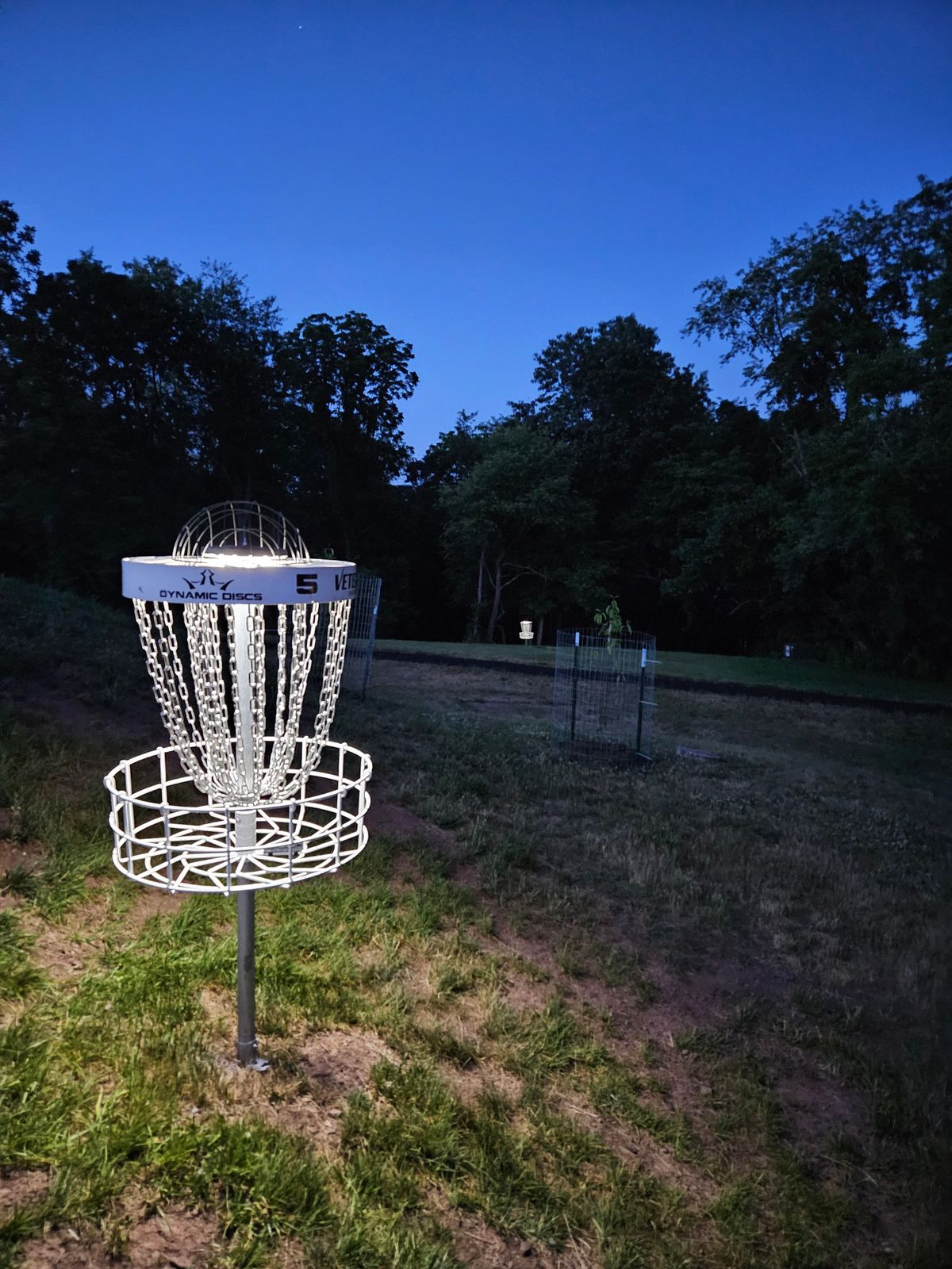 Hole 5 with hole 8 basket in the background with permanent solar lights