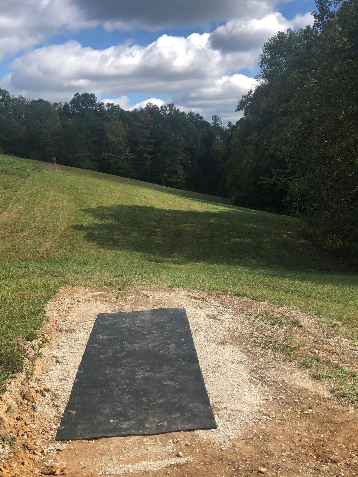 Hole 16’s Tee pad. Plays opposite side of the field in a set of trees.