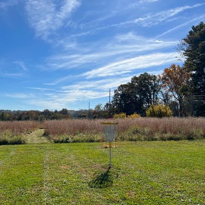 At the basket on hole 1. Fresh cut path to the Tee on hole 2!
