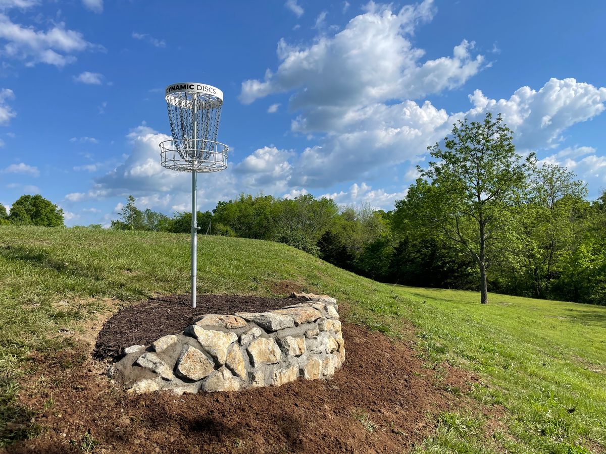 Hole 6 basket on the side of pond dam.