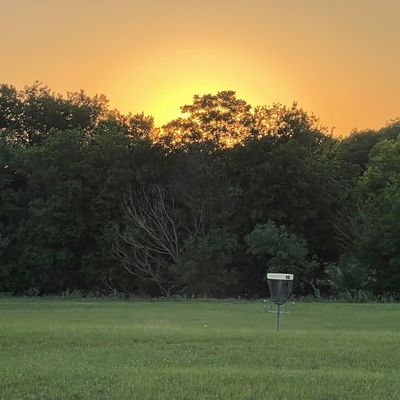 Sunset from 18 tee box overlooking basket 16.