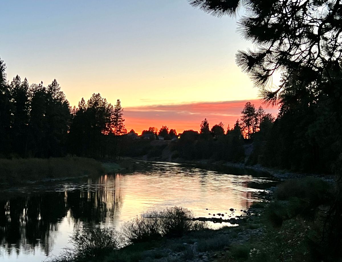 View of sunset over Spokane River at hole 8