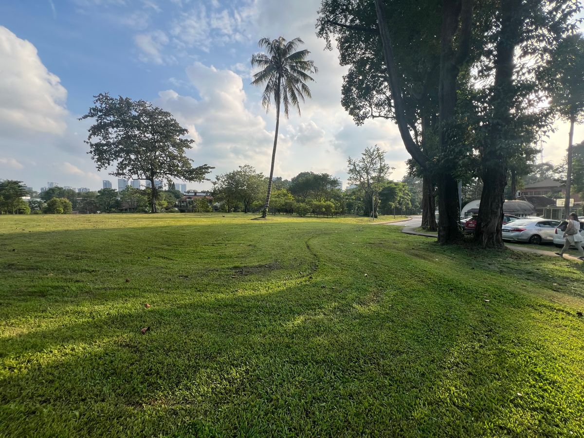 Hole 4 green area looking back towards dogleg. OB parking lot R side of photo.