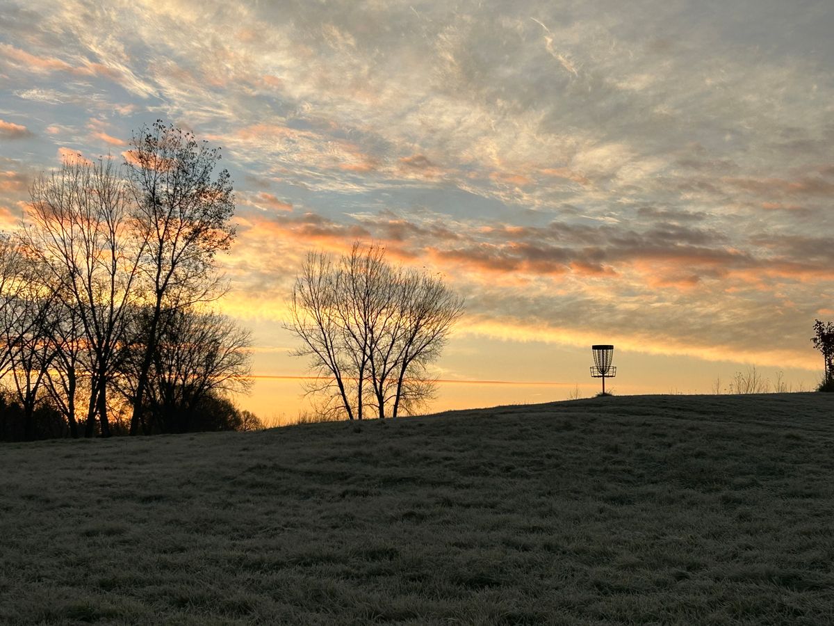 Hole 8 basket with sunrise