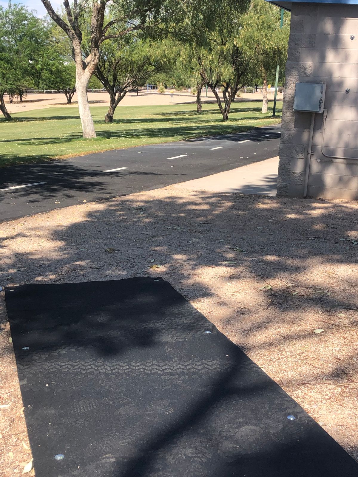 Hole 13: Throwing east to basket in gravel on hillside.