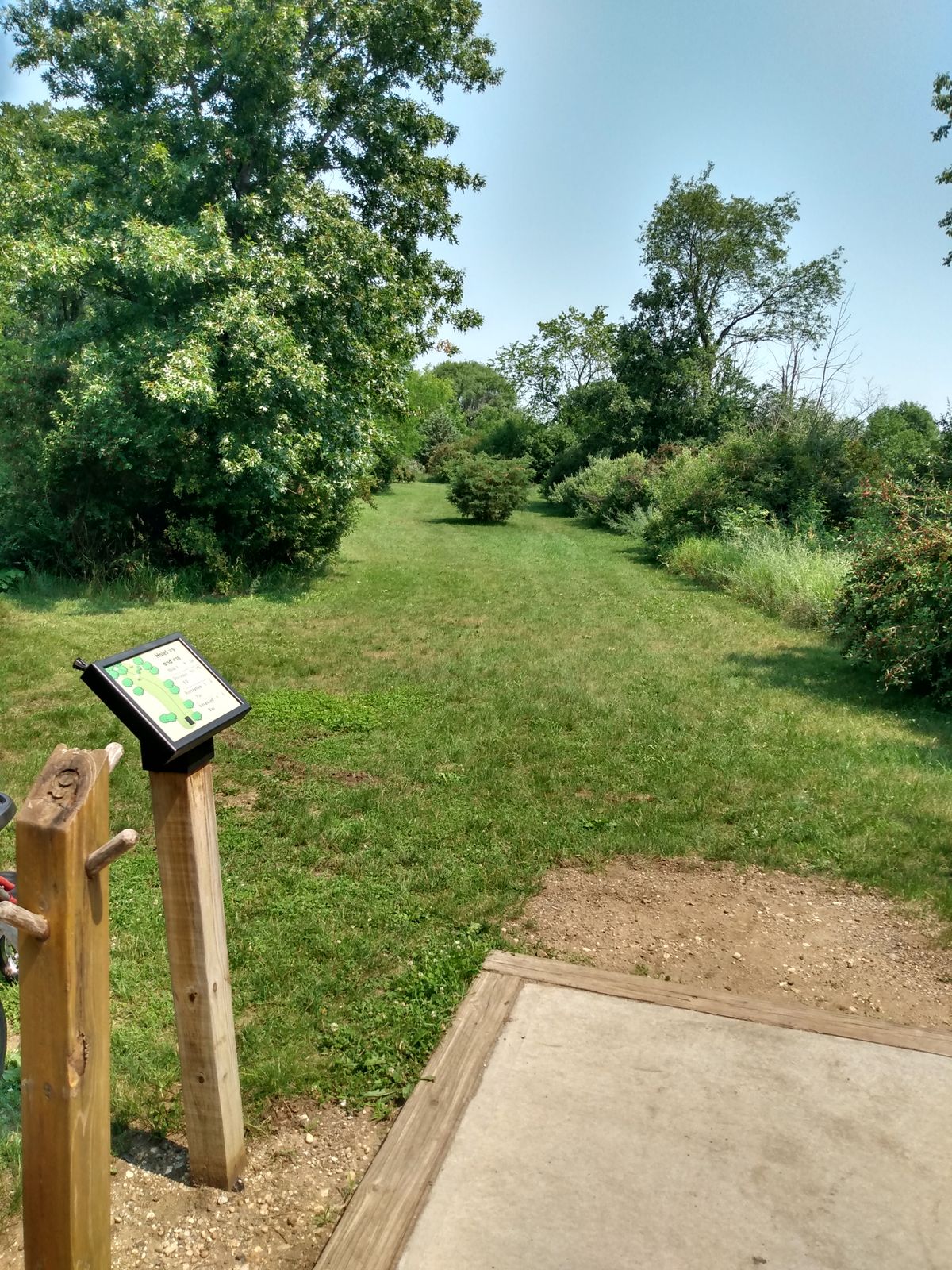 Both hole 9 & 18 are up and to the left. 18 is the long hole and the basket sits down a hill a little bit.