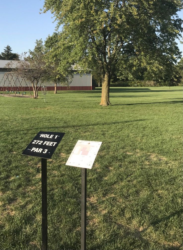 Hole 1 is way beyond the tree; Hole 9 to the left of it