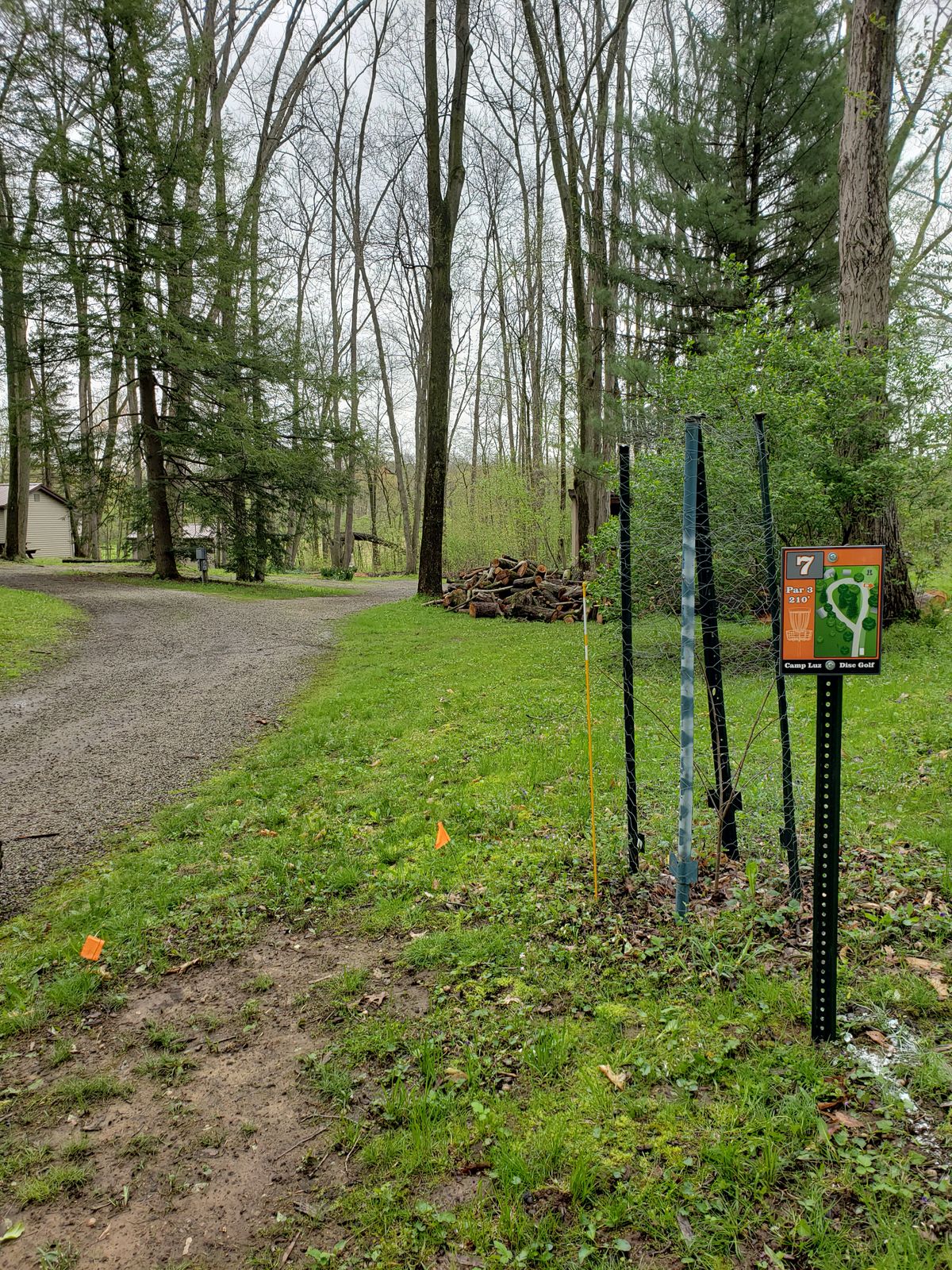 Basket for hole 7 is just to the right of the lane.  Note that there are parking areas along the left side of this hole.  Please use caution if vehicles are present.