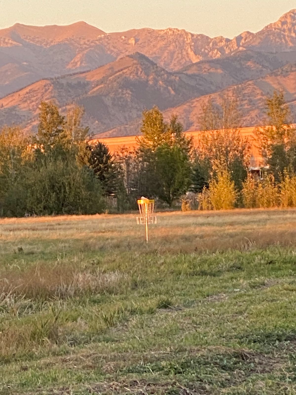 New hole 11 282 par 3 ob creek on right side Bridger mountains in background