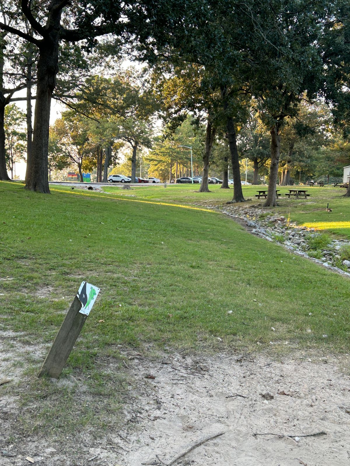Hole 18 uphill straight ahead with creek short between pin and tee
