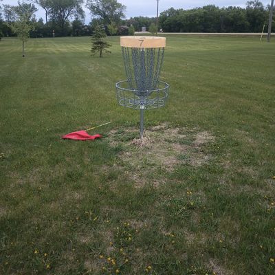 Basket on hole seven looking back towards the tee. The basket of six is also in the background.