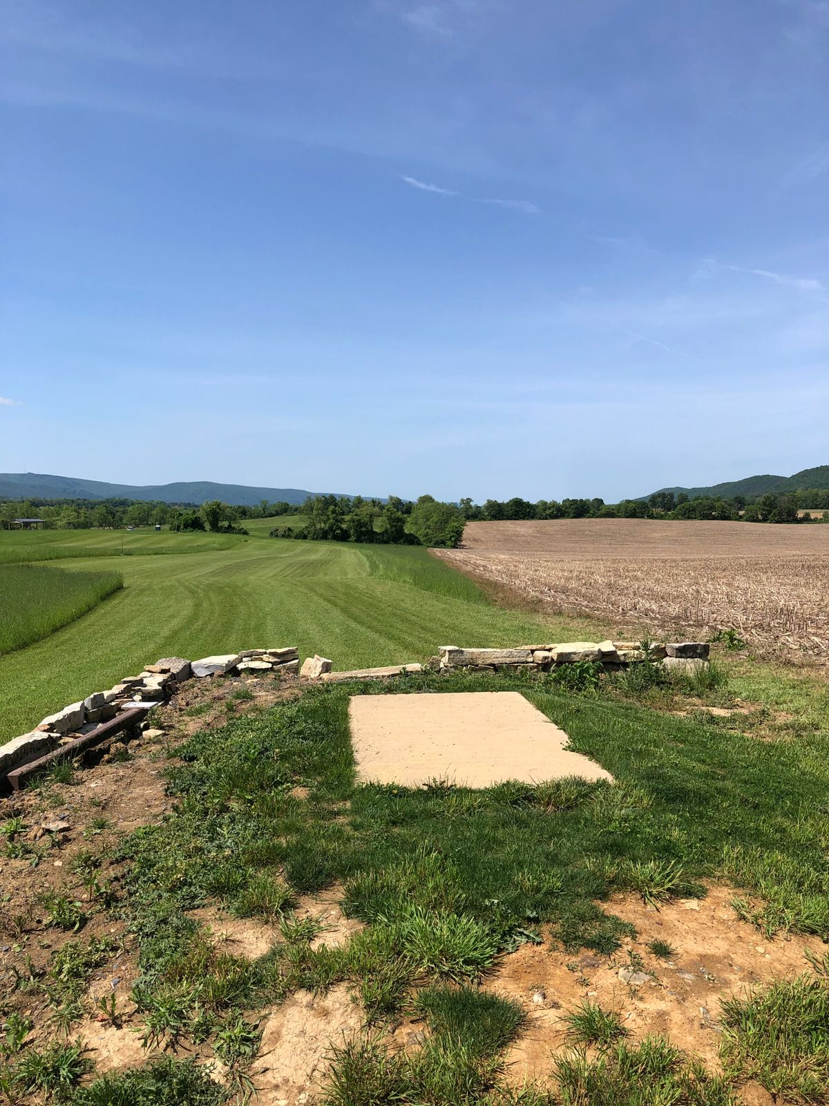 Hole 18 long tee with rock wall