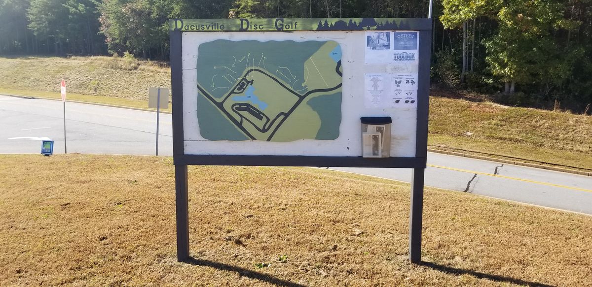Entrance sign, map, and scorecards.