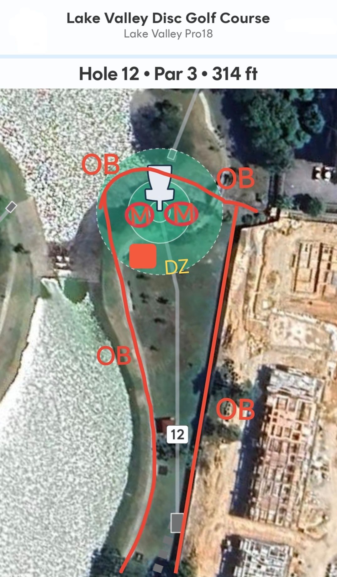 Path OB on right, fence on right OB, Concrete and ditch behind basket is OB. Shelter's concrete floor is OB. (walkway in front double Mandos is NOT OB. Must throw through in between double Mandos in front of the basket. (marked as 2 coconut trees.) 