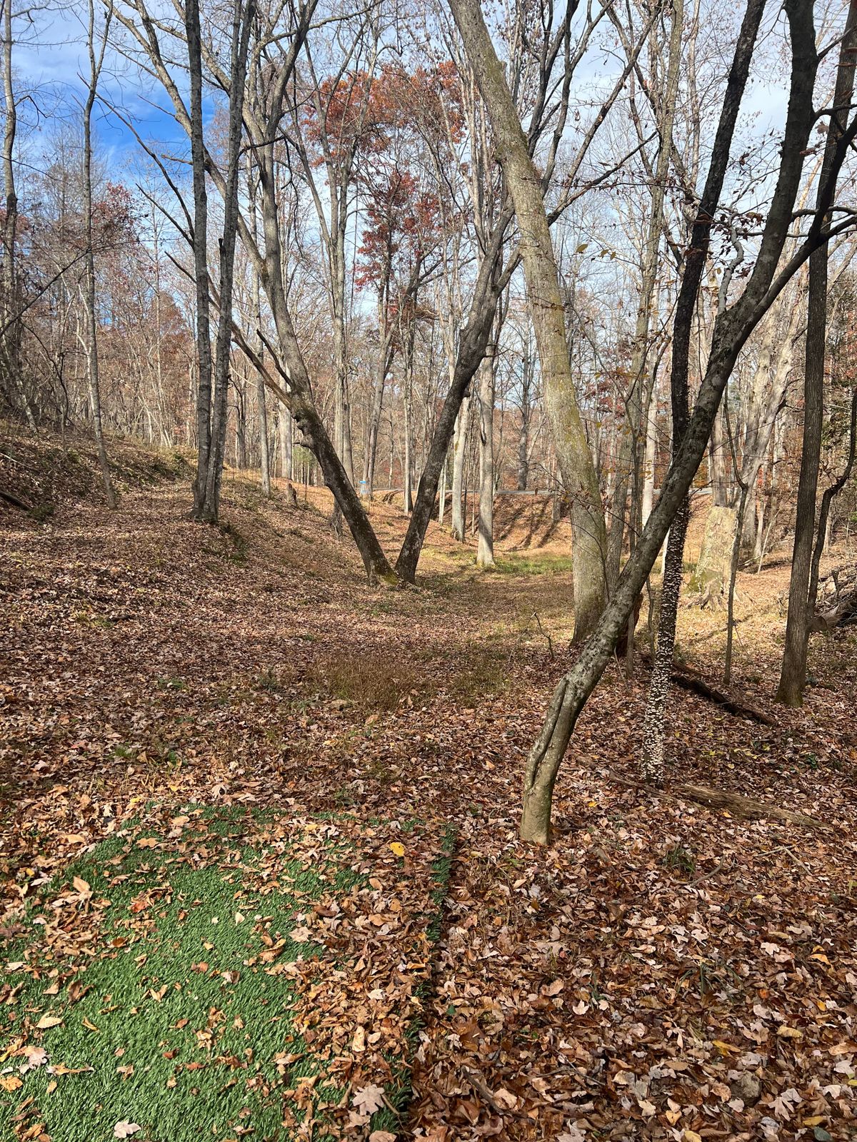 Hole 11 White Tee: Double Mando through the V