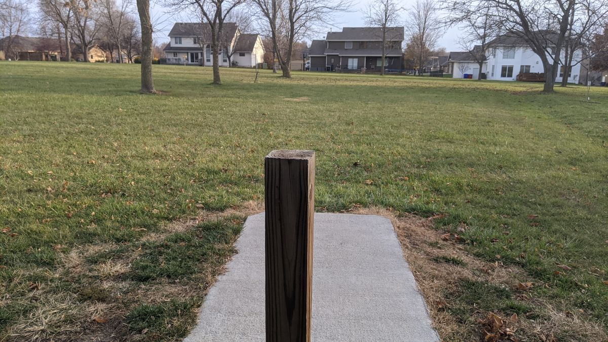 Tee #7. (Basket in line with post just beyond tree)