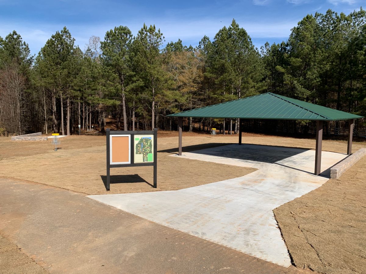 Course pavilion, practice baskets and hole 1 tee area.
