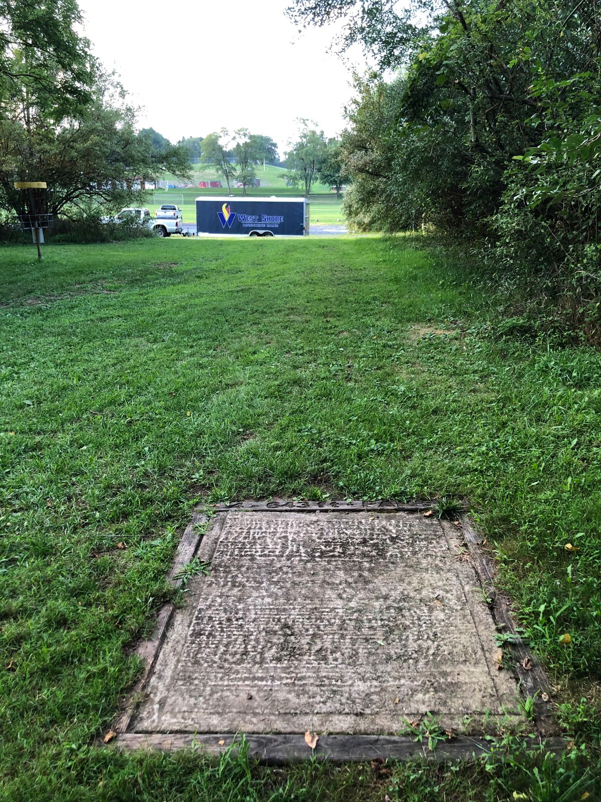 If hole 4 is blocked play as a par 4 from the wood chips area beyond the trailer shown.