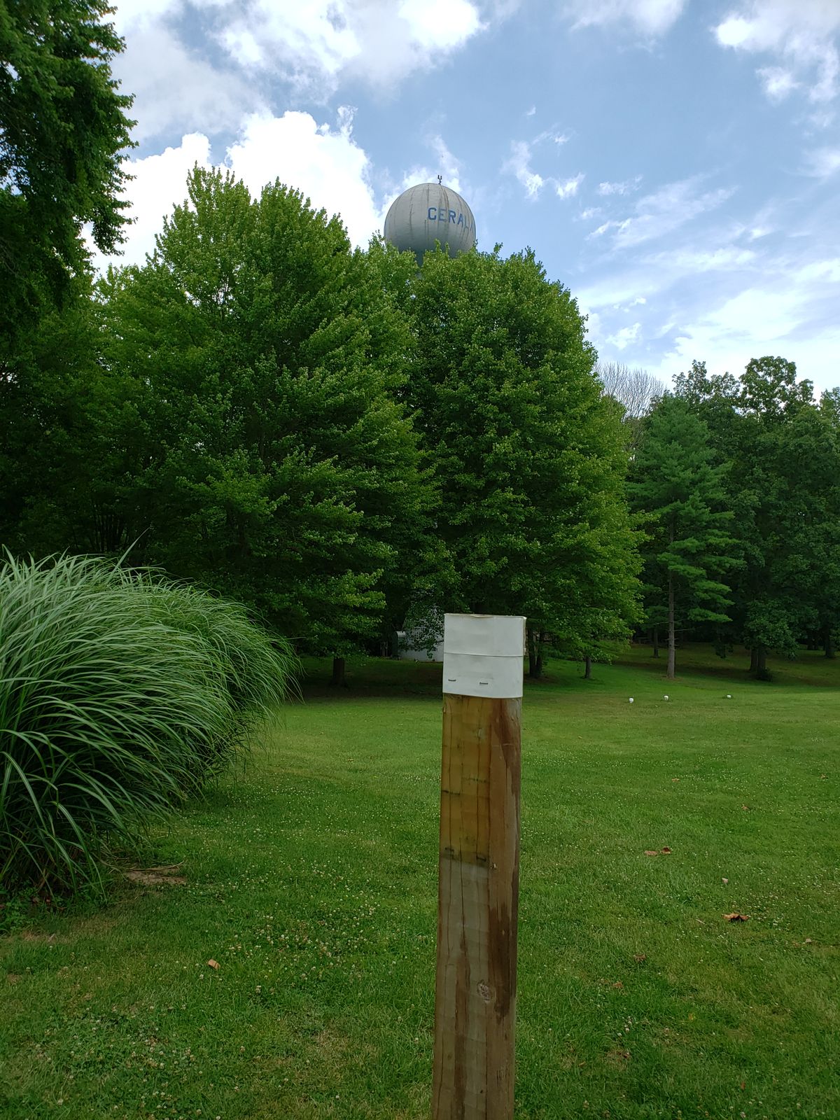 #2 Amateur Tee Sign Post showing water tower on left.