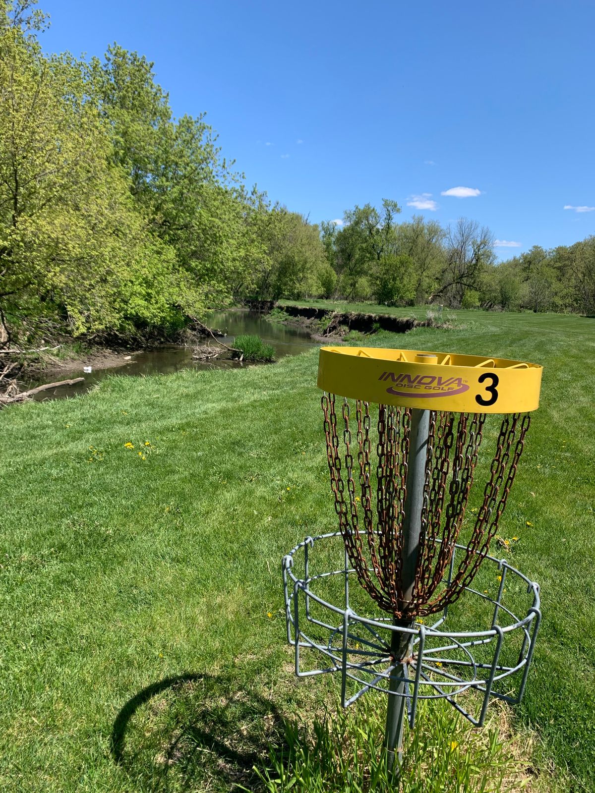 View of hole 3 basket. River located 25-30 feet left of basket. River was shallow as it's been dry.