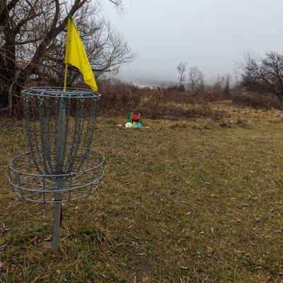 Foggy view of the dam from hole 6 basket during a warm December 2023