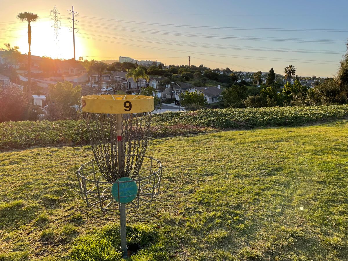 Hole 9 basket at sunrise.