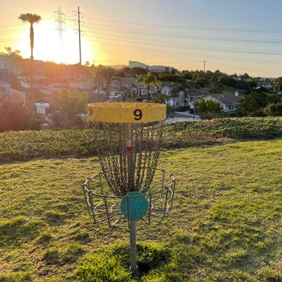 Hole 9 basket at sunrise.