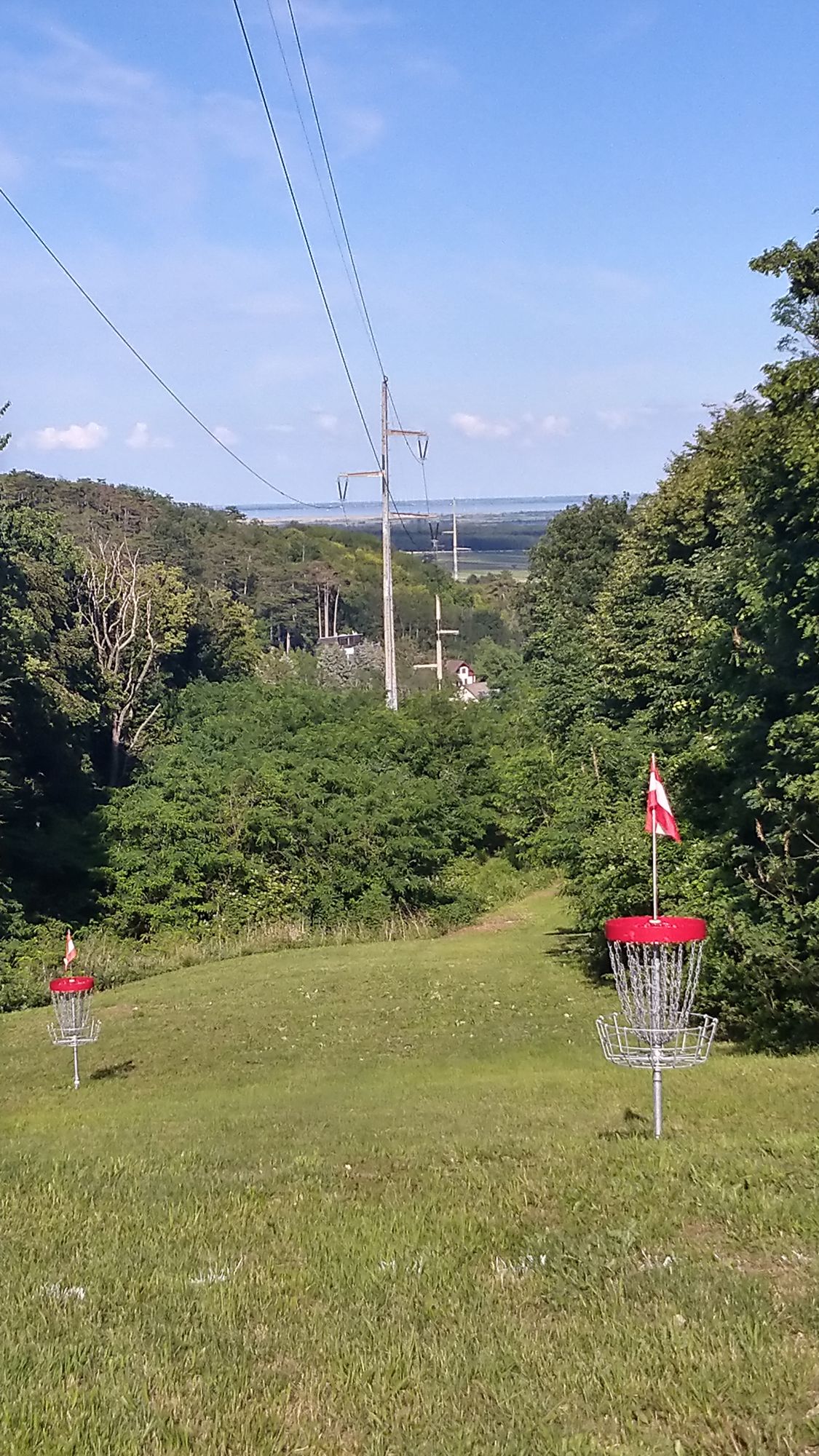 Foreground: Baskets of hole 10 and 12. Background: Lake Neusiedl