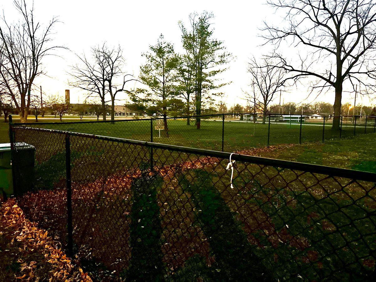 Holes 1 & 2 near fenced do park. Practice basket on other side of fence. Good setup