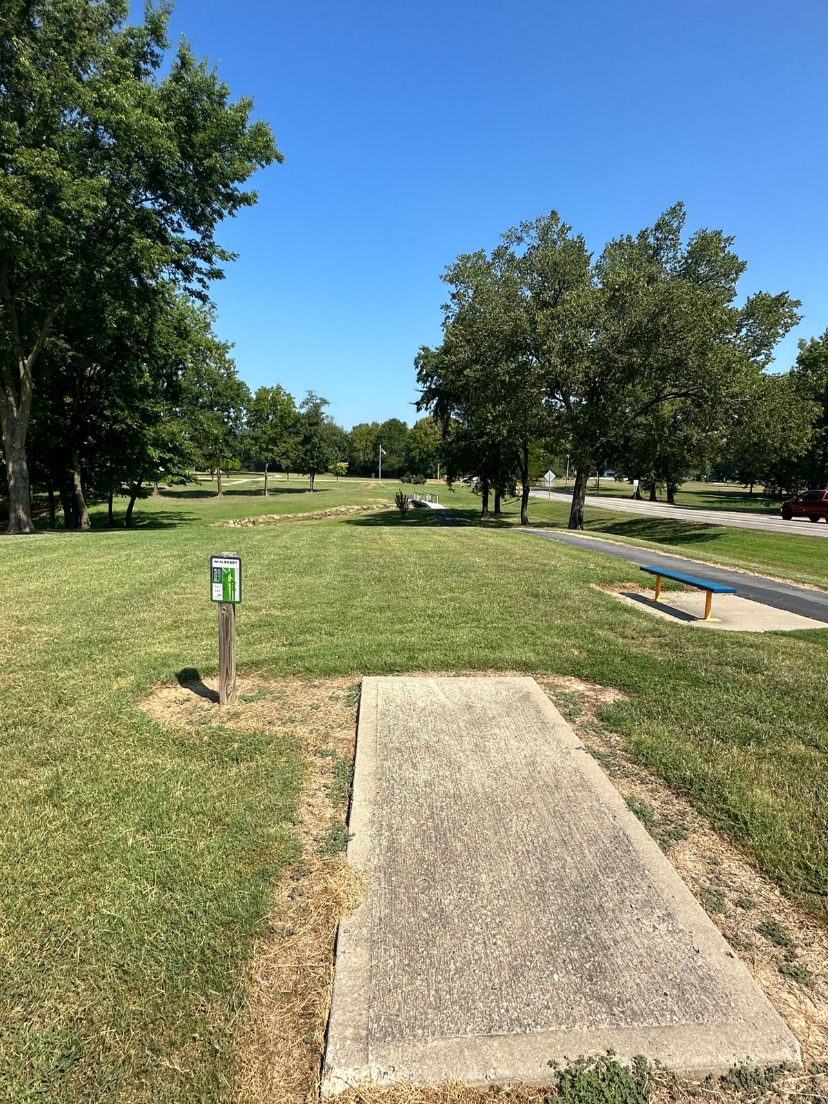 Hole 9 Tee pad Mulberry Arkansas Disc Golf Course. Beware the road on the right & the creek on left