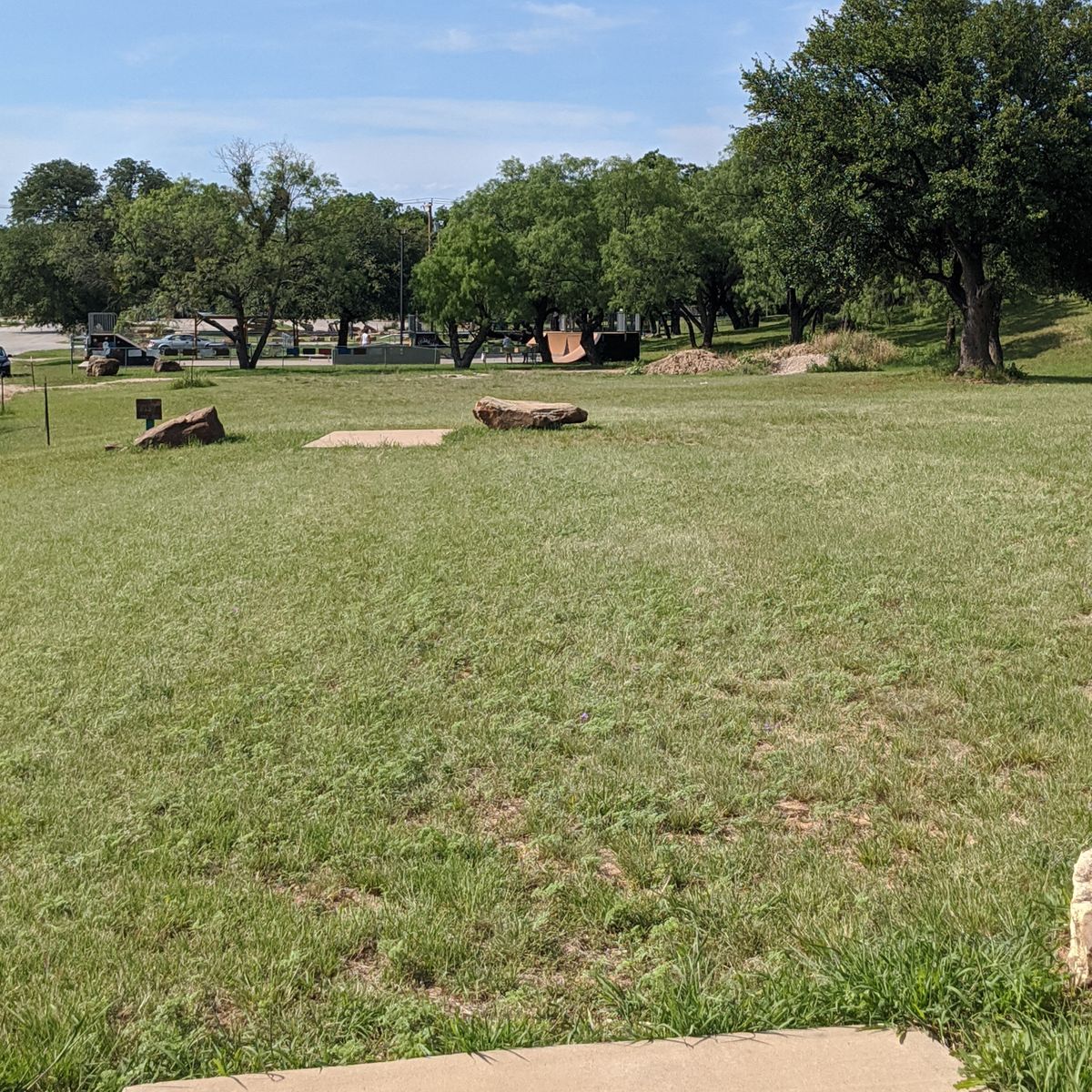 Hole 9 from tee to basket. Look at the picture for hole 18 for a slightly better picture of the basket location.