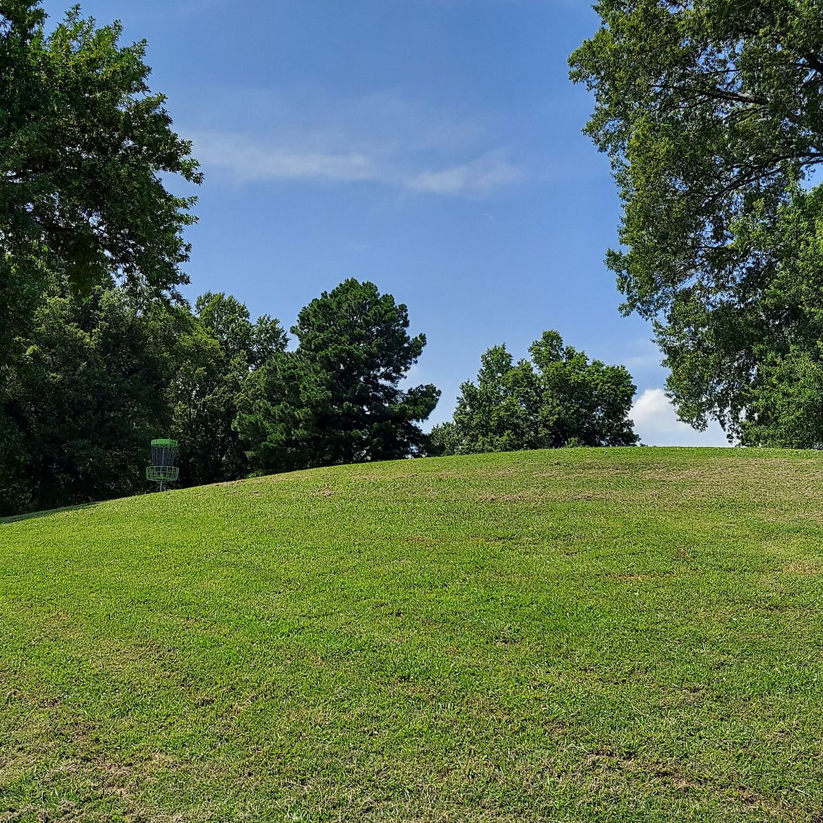 Hole 1's green up the rounded hill.