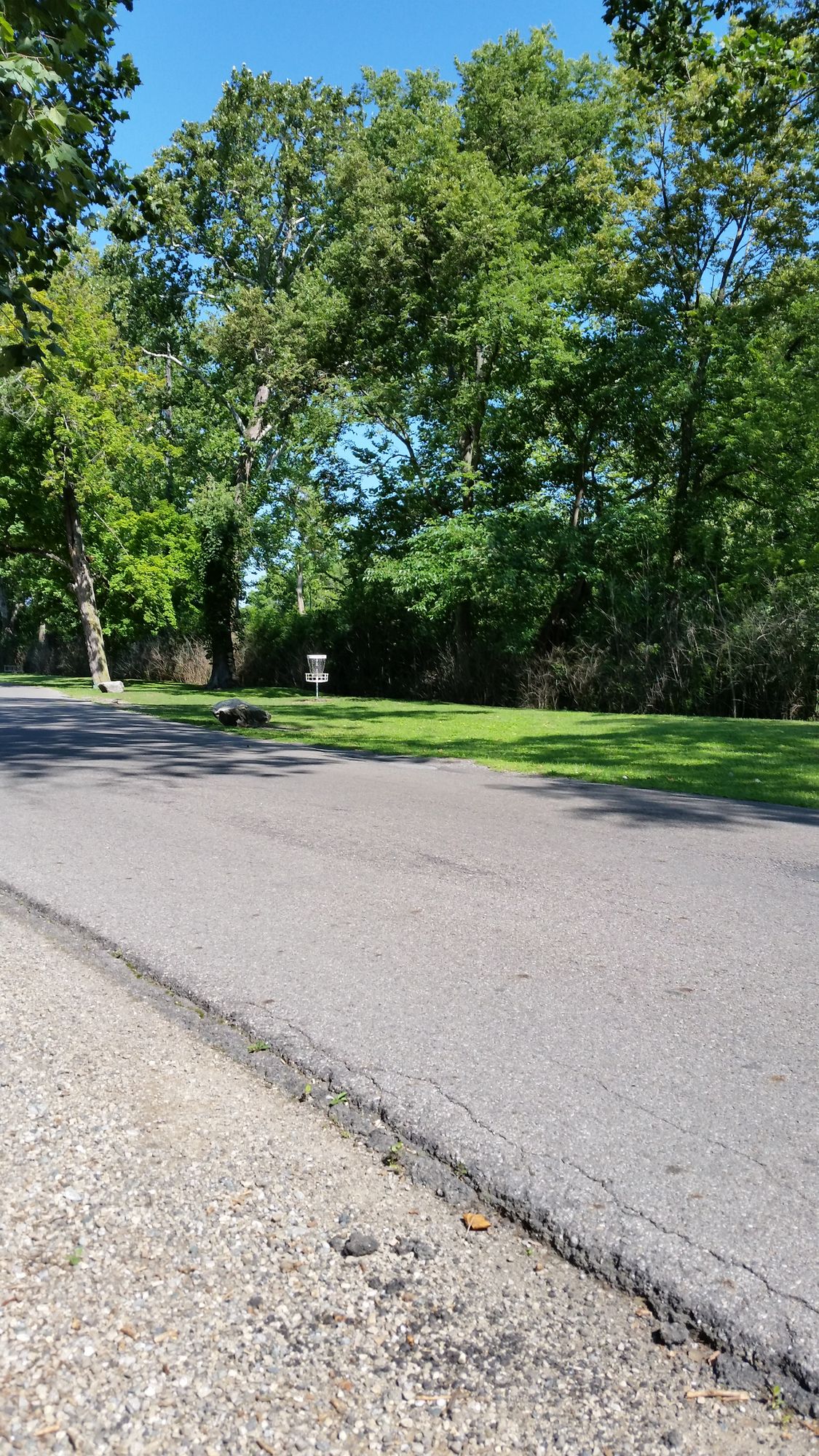 One of a three holes in between road and river