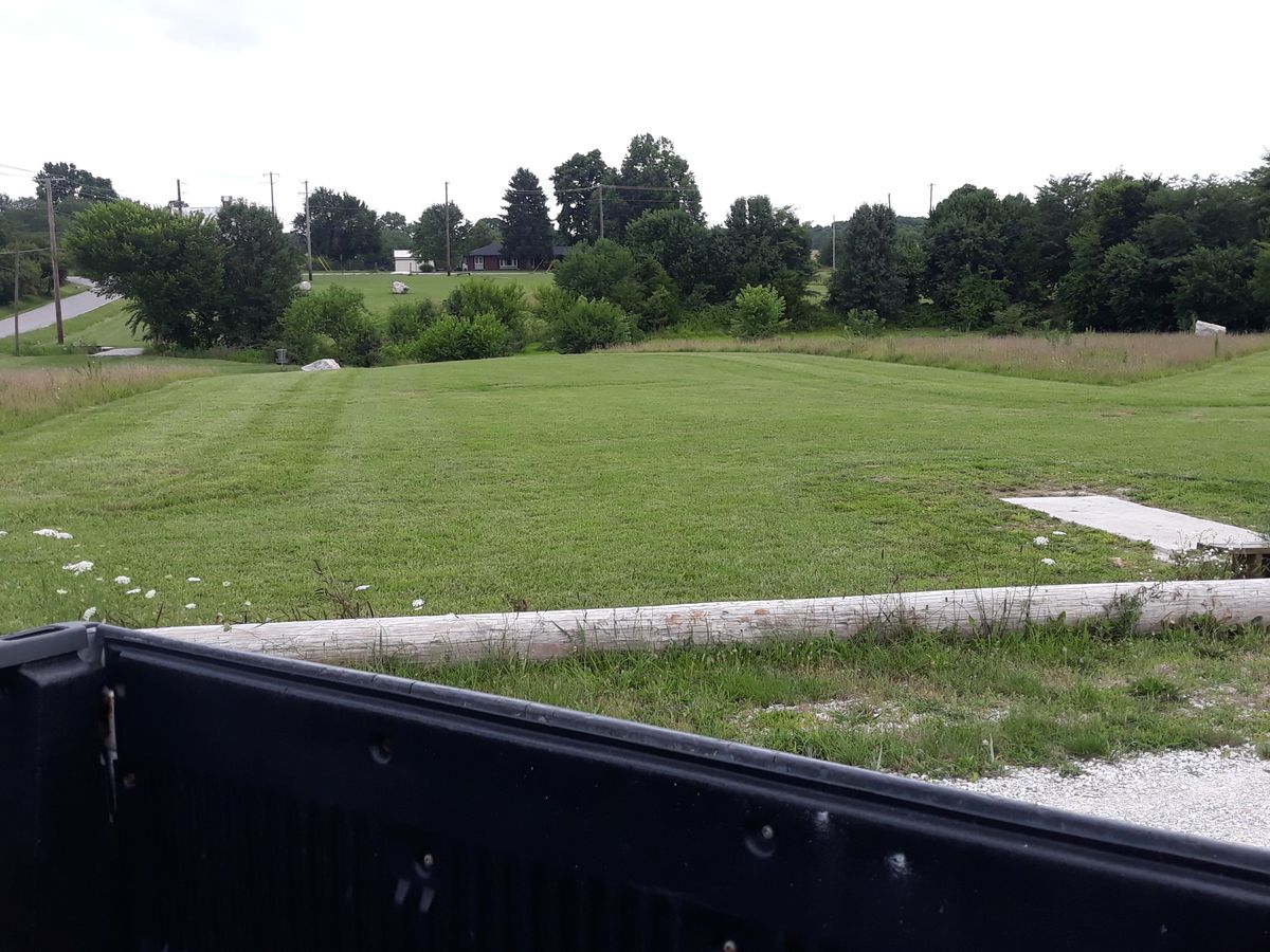 Clear to play. Freshly mowed and in the wooded area.
