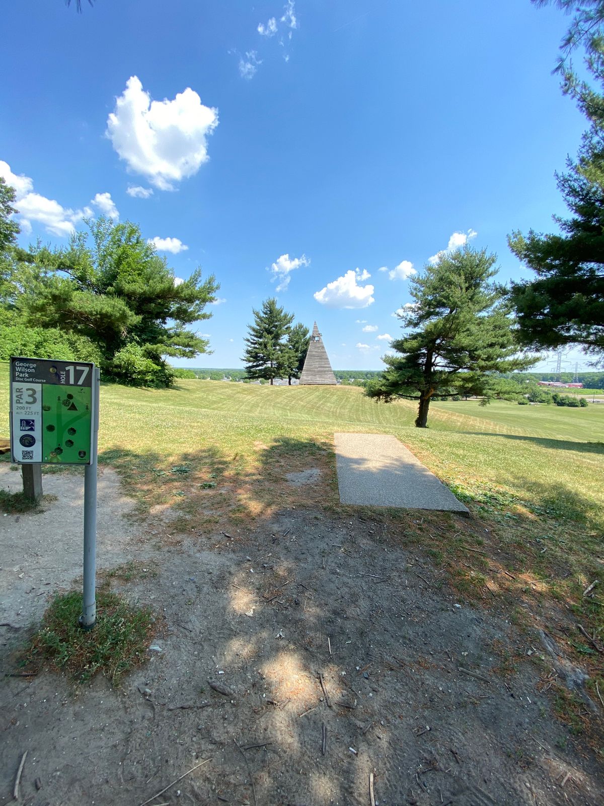 Hole 17 Tee, hole off to the right of the building behind the tree.