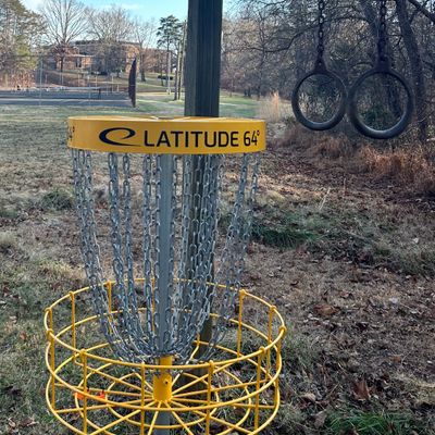 Hole 6s unique basket location surrounded by outdoor gym equipment