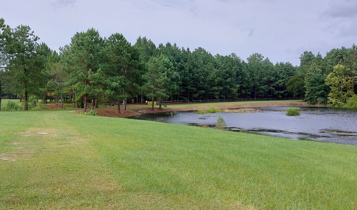Work is done on hole 1's pond and the water back up.