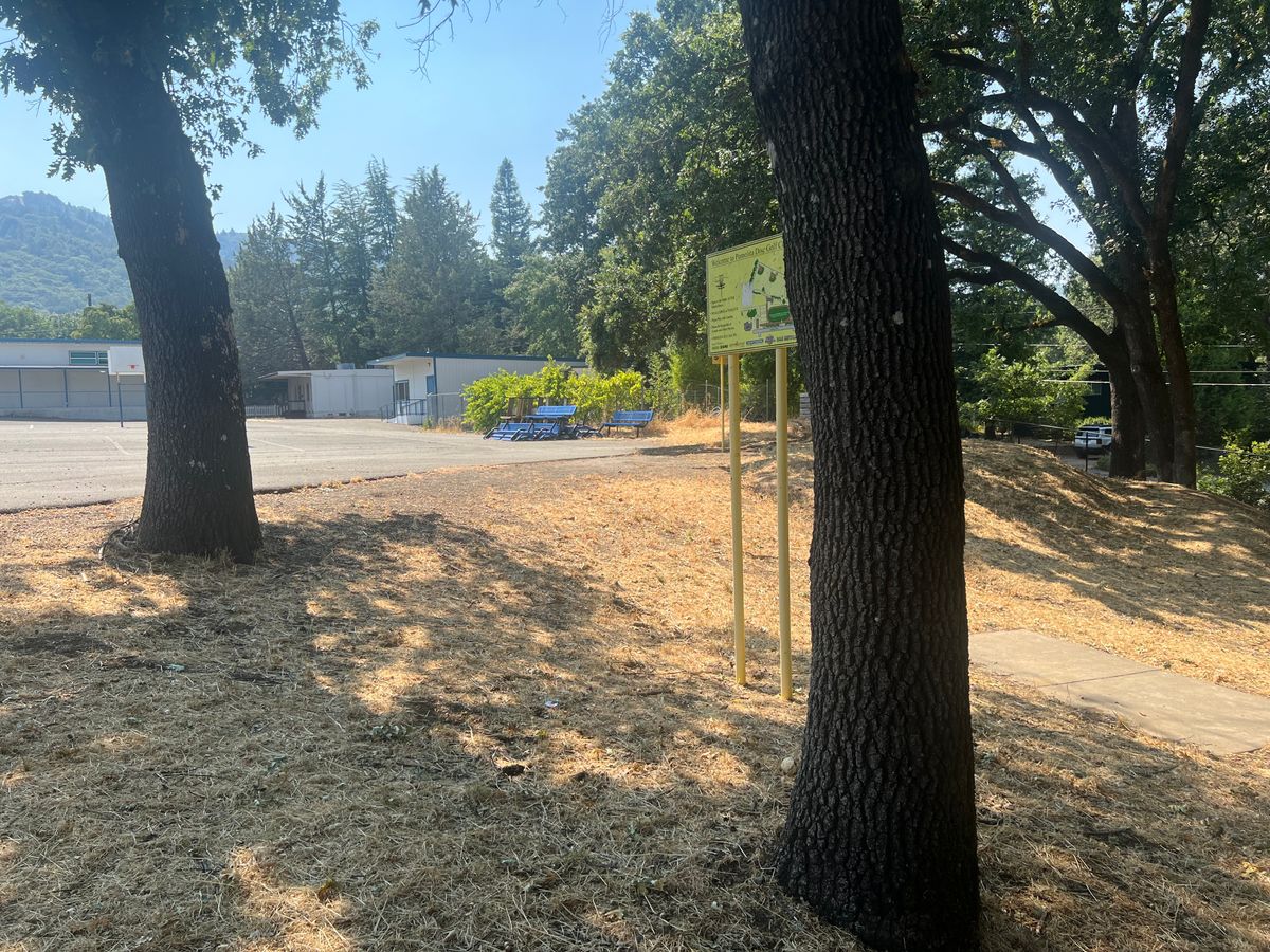 Hole one next to the basketball court.