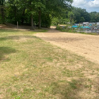 Hole 7 by the lake.  Basket tucked in between the trees.