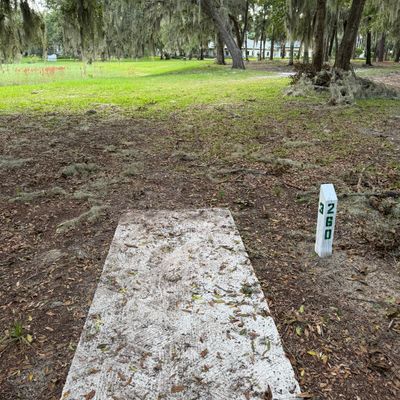 Surrounded by water is OB.  Mando to the left of the third tree past the picnic table on the right hand side of the fairway.  