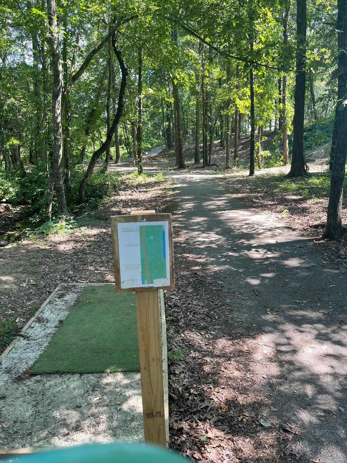 Hole 4 up on the hill behind trees