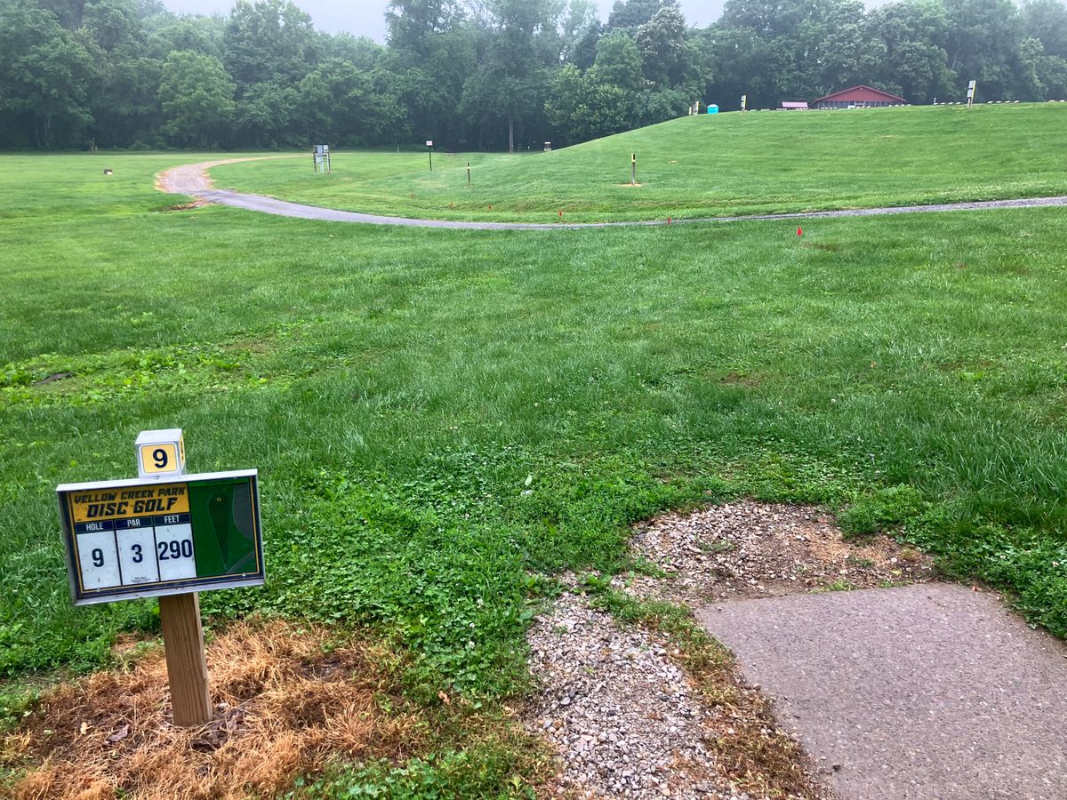 Hole 9 sub300’ shot.  Basket on the hillside.