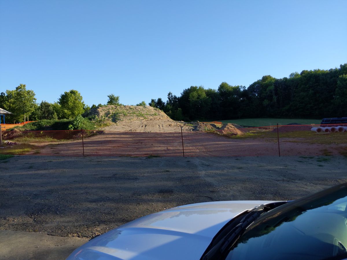 Half of the field is a pit for construction.