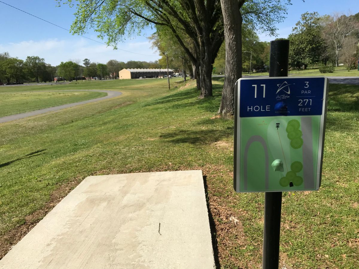 No. 11 tee box looking at basket straight ahead right of bend in walking track.