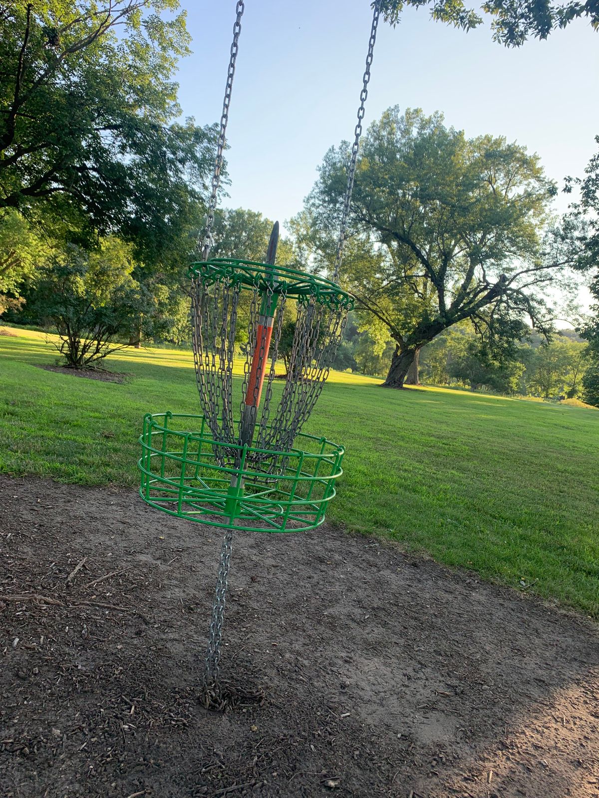 View of hole 1 hanging basket. Green baskets on the front 9.