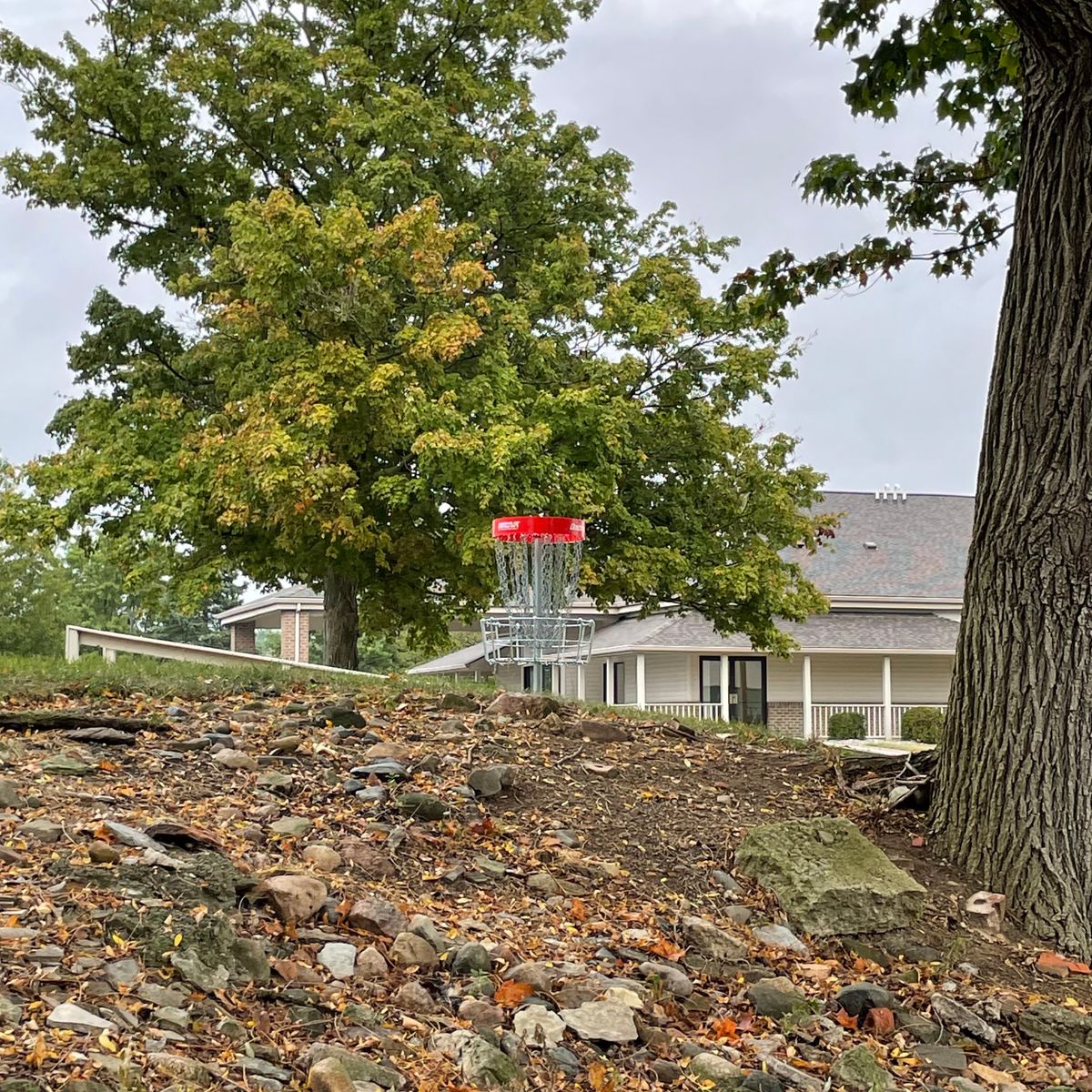 Hole 9’s basket, up on a rocky hill through a gap.